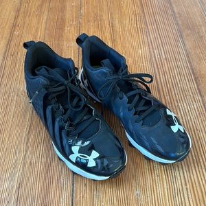 Under Armour football cleats, size 5Y, black and white.